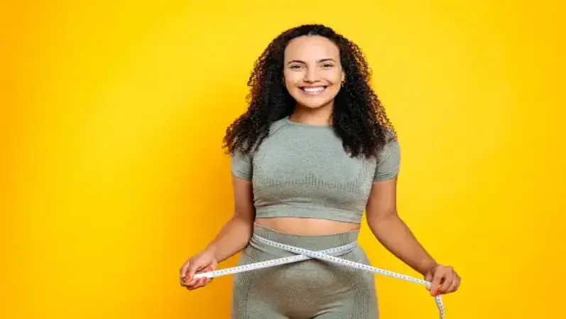 Image of a women with tape around waist