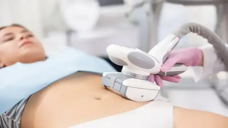 A woman undergoing body contouring procedure